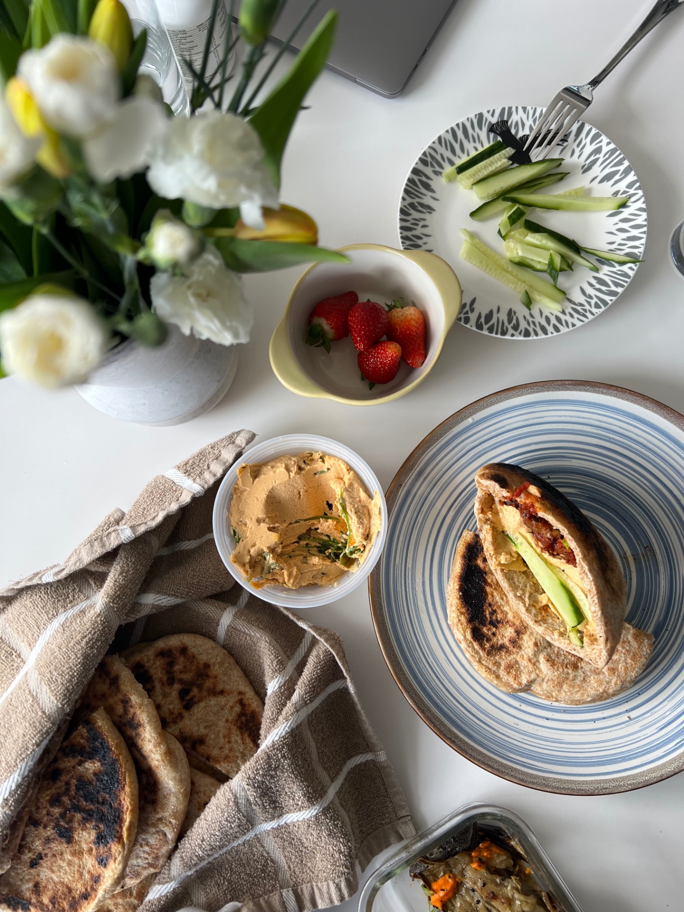 Pita, hummus, and fresh sides