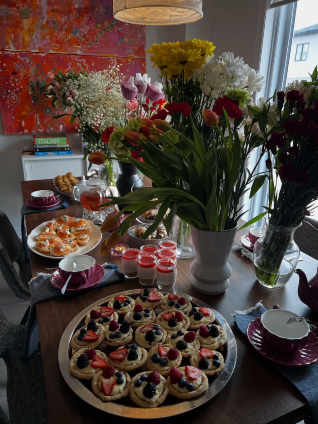 High tea table with flowers and pastries