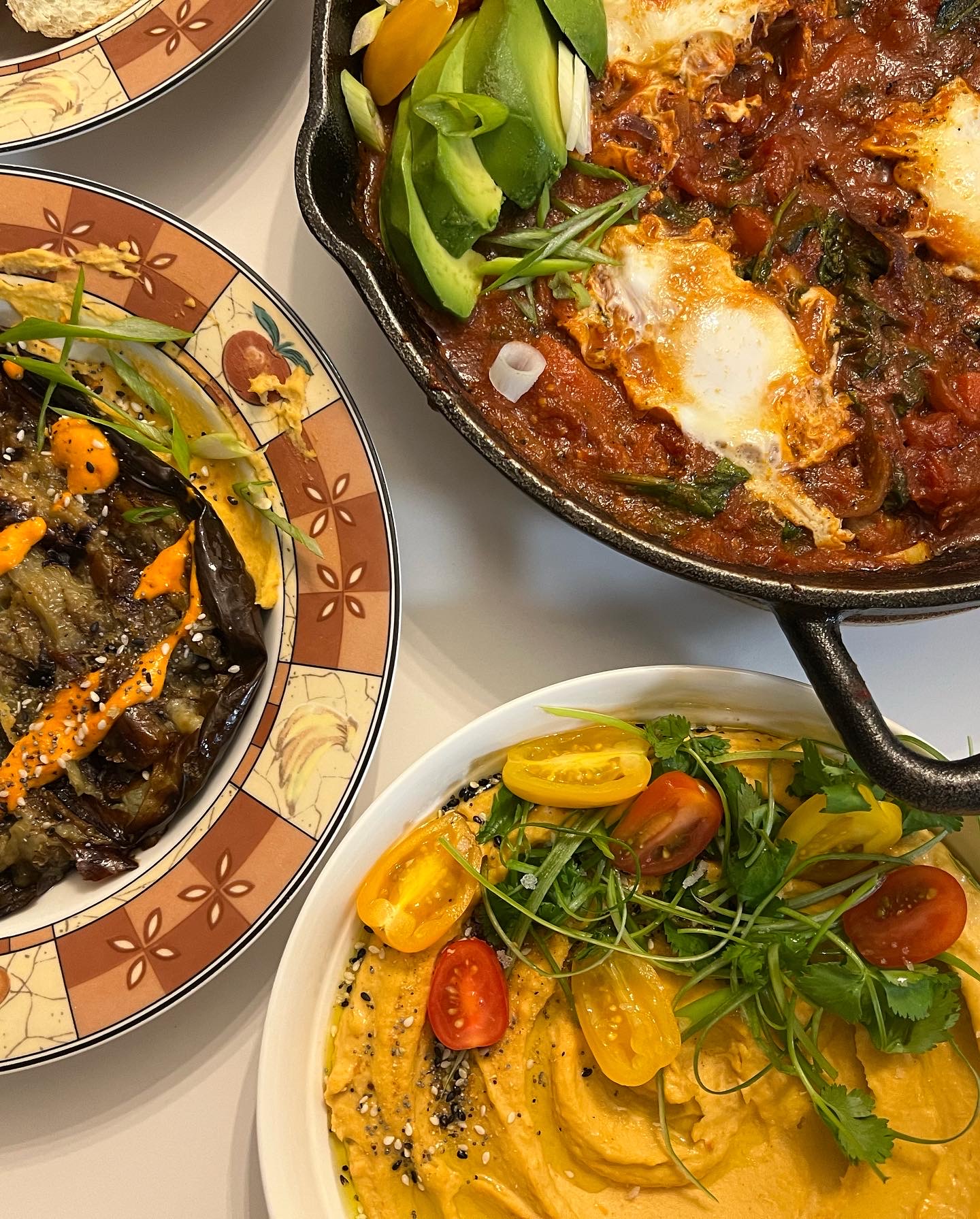 Shakshuka, baba ganoush, and hummus